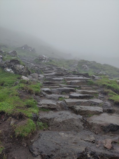 Stone steps leading up a mountain in fog