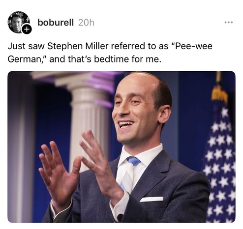 Stephen Miller shown smiling and gesticulating with both hands.