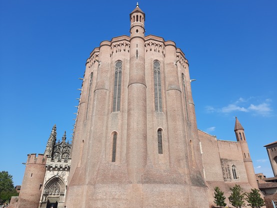 The severe brick exterior of a southern French church