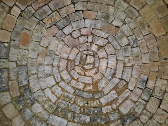 Concentric stone work of the inside of a dome in the ruined chateau