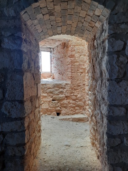 The stone interior of a ruined castle