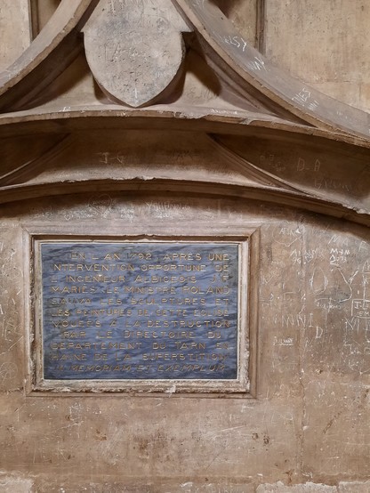 A plaque in Albi cathedral commemorating someone who supposedly saved some of its precious historical artifacts from the hands of the iconoclizing secular Directory during the French Revolution in 1792.