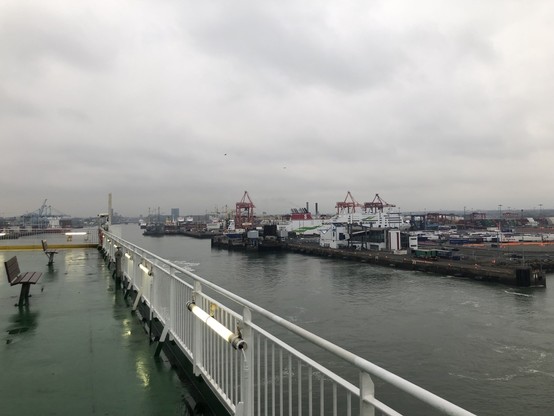 View from the deck of my ferry to the Dublin port. The sky is grey and cloudy with a light drizzle.