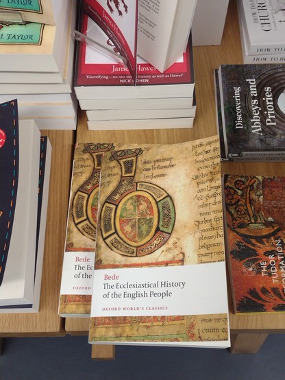 A collage of books on a table 
