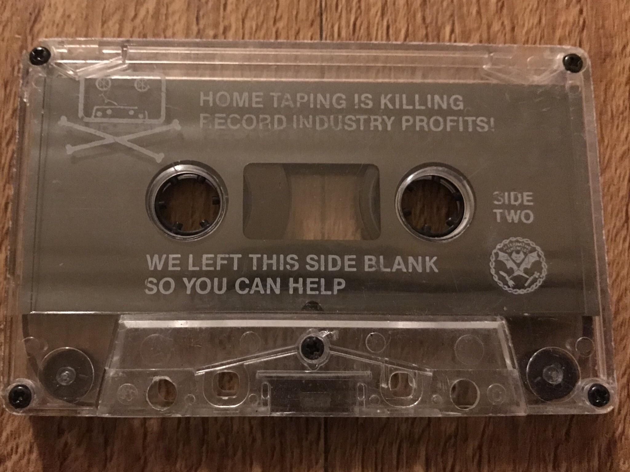 Dead Kennedys cassette tape.  It bears the slogan 'home taping is killing record industry profits '.
Then below ' we left this side blank so you can help '